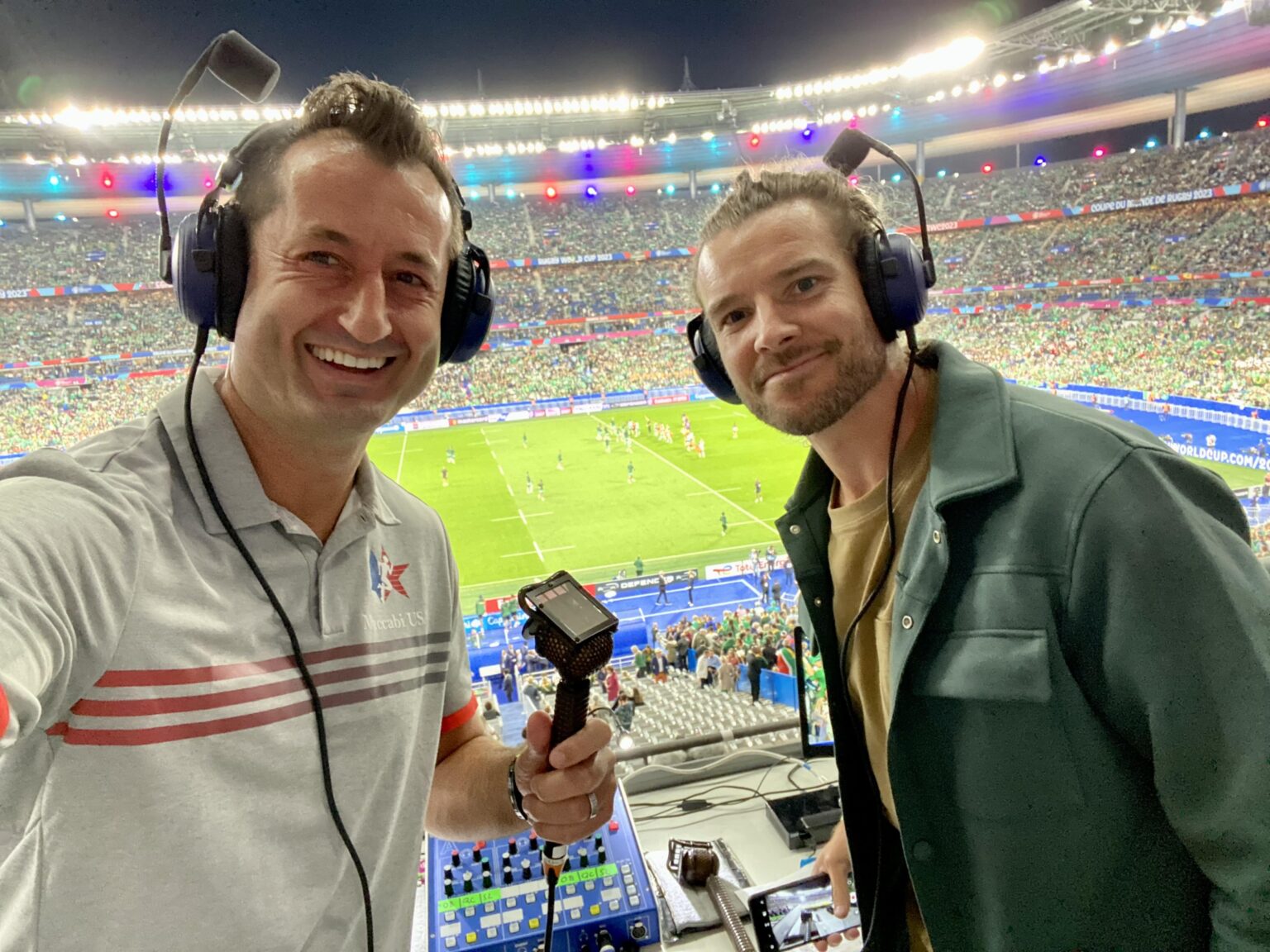 Dallen Stanford commentating with a headset in a stadium