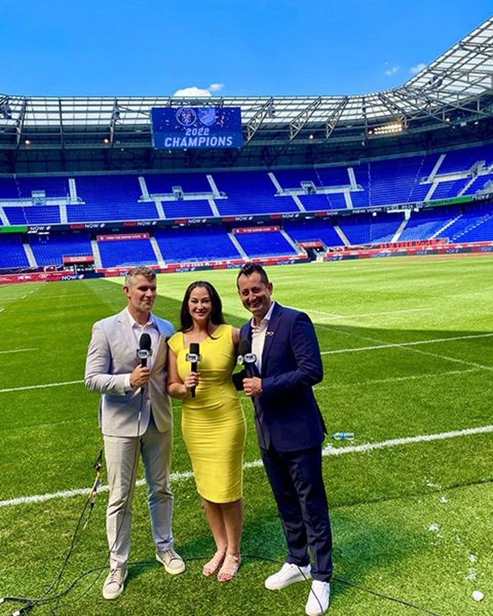 Dallen Stanford presenting pitchside with the broadcast team