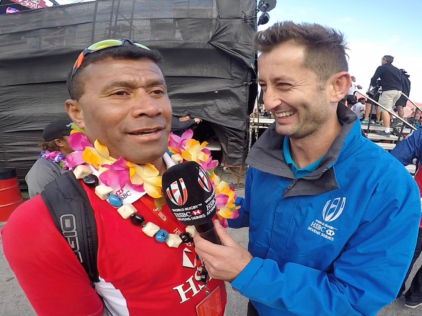 Dallen Stanford interviewing a player pitch-side at a sevens tournament